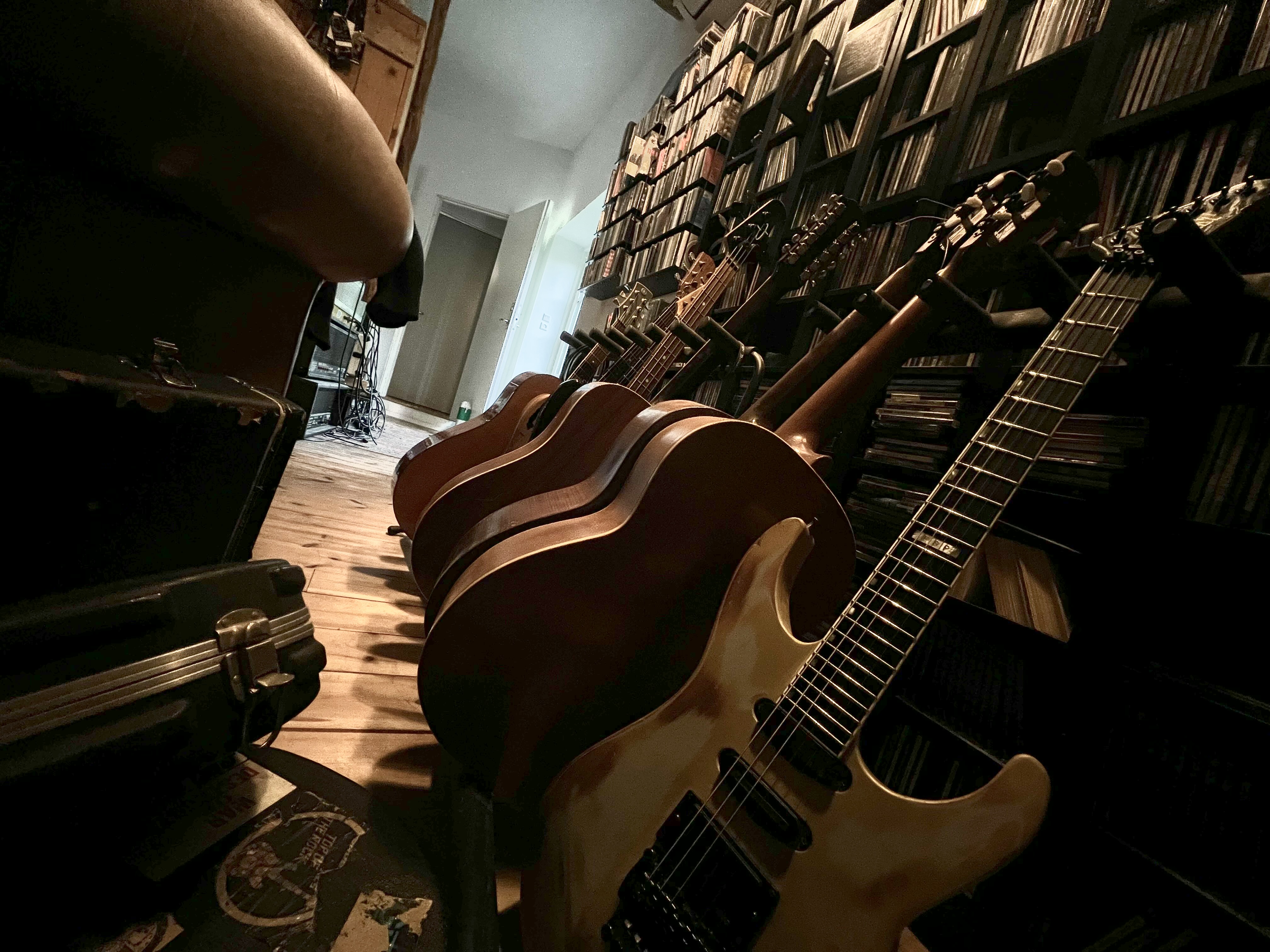 Dark guitar leaning in the room
