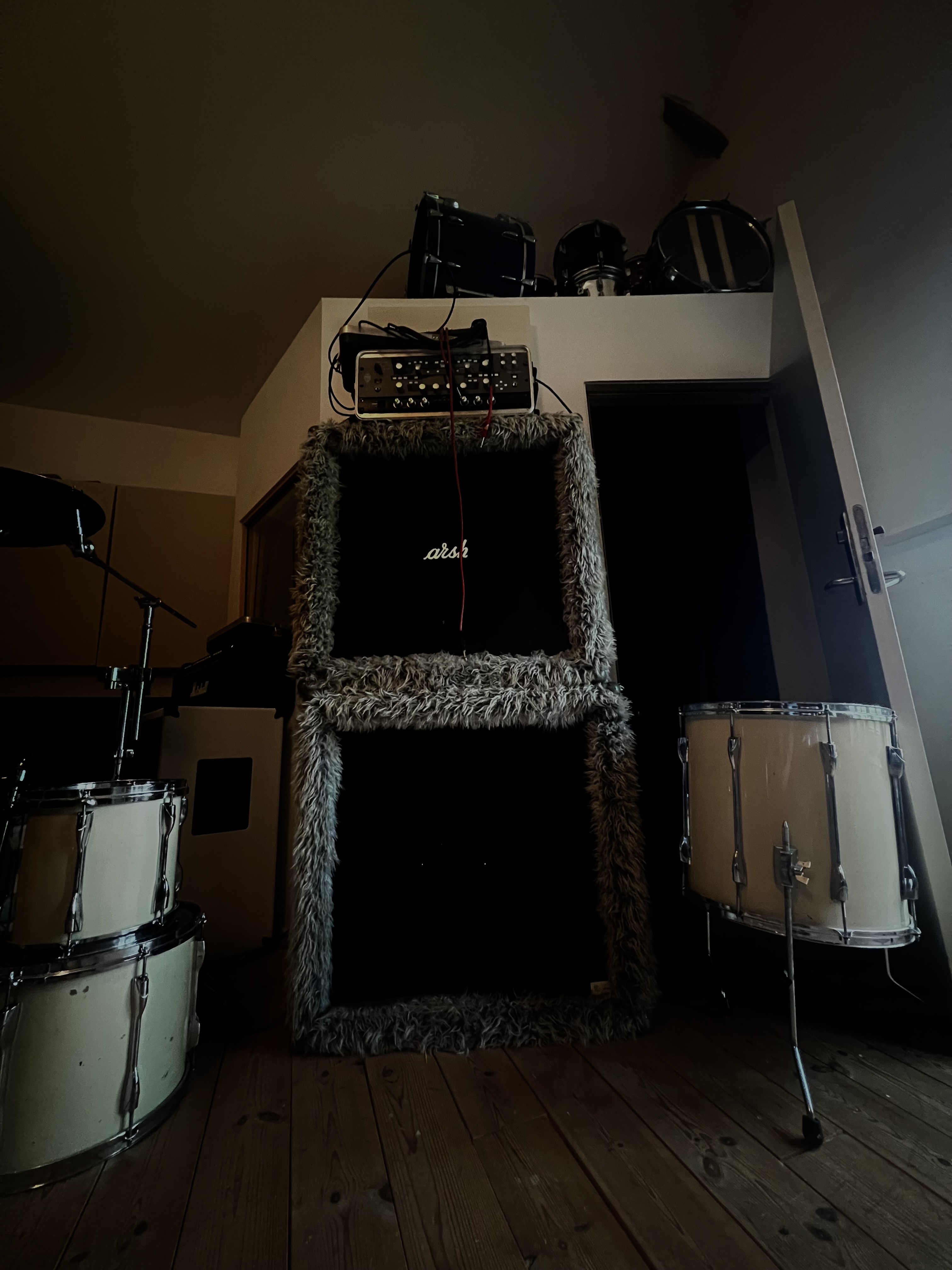 Stacked cabs and drums in the live room